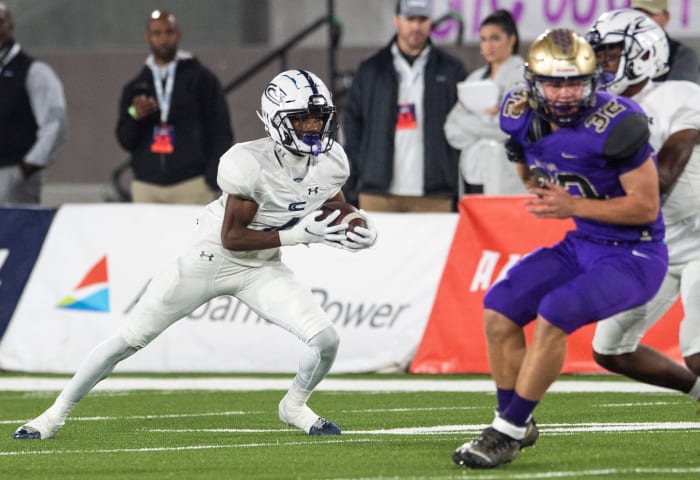Clay-Chalkville's Mario Craver (4) turns up field after a catch during the Class 6A football state championship at Protective Stadium in Birmingham, Ala., on Friday, Dec. 3, 2021.